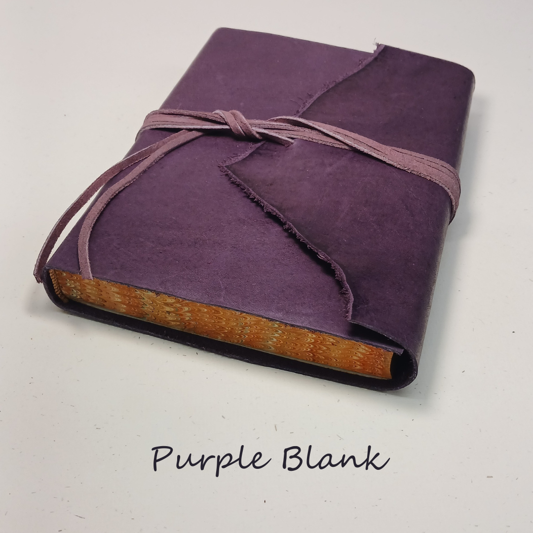 Purple leather-wrapped book on a light gray background